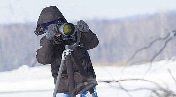 Un fotografo sulla neve.