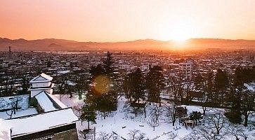 Sunset view of Aizu Wakamatsu city and castle park from aerial angle