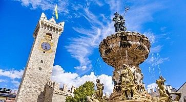 Fontana del Nettuno (Neptune fountain) in Trento and the Torre Civica or Torre di Piazza