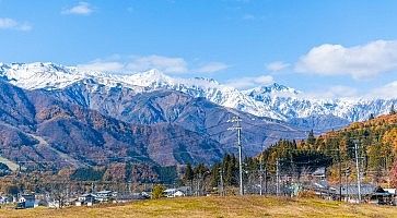 Beautiful landscape view of  Hakuba in the winter with snow on the mountain and blue sky background in Nagano Prefecture Japan.