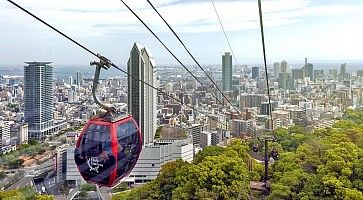 Kobe, Japan - April 2016: Kobe cityscape and skyscraper seen from ropeway to Nunobiki Herb Garden on Mount Rokko in Kobe, Japan